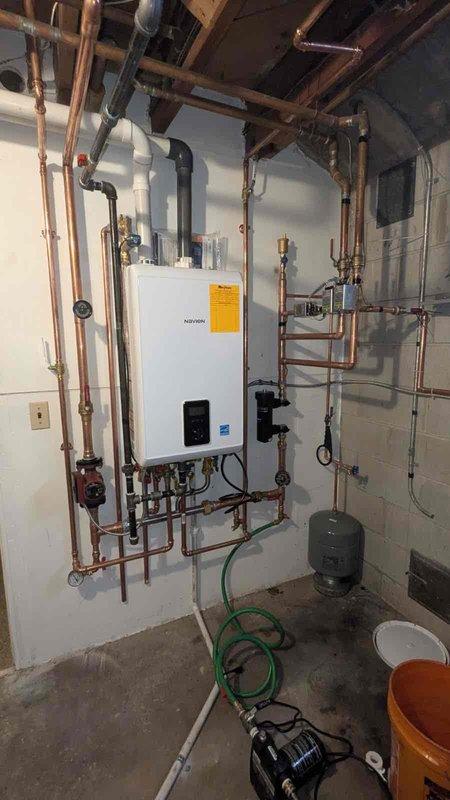 Responded to No Heat call for Navien tankless boiler system with reported pressure loss. Upon inspection, found system had lost water pressure due to a small leak in one of the copper supply lines. Repaired the leaking joint, refilled the system to proper operating pressure, and verified proper operation through complete heating cycle. System now maintaining pressure and providing heat as designed.