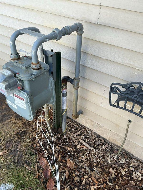 Performed site assessment for Reznor garage furnace installation. Documented electrical panel with Square D breakers and available capacity, as well as existing gas meter configuration with associated piping. Customer not present during inspection; will provide estimate for recommended heating solution based on garage specifications.