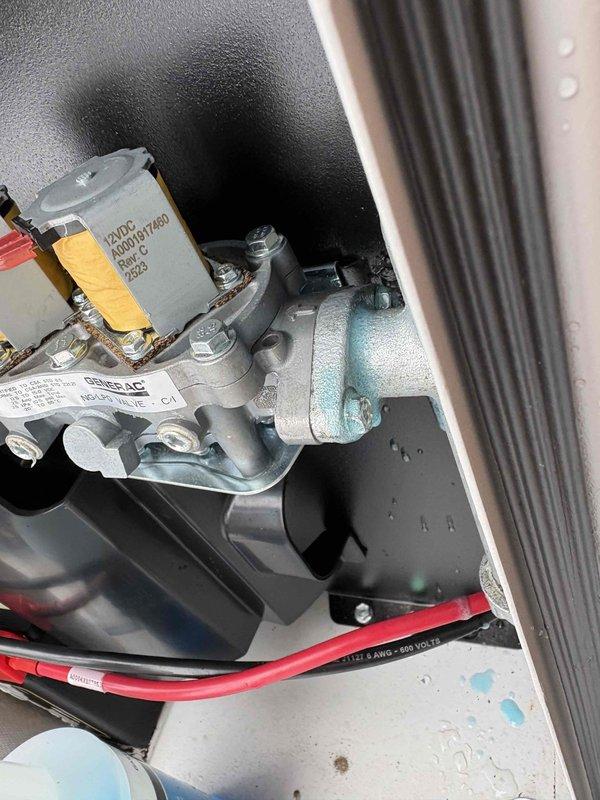 Performed Generac safety inspection in accordance with SIB25-22-H requirements. Inspected gas valve assembly and identified the need for part replacement. Installed warranty part A0009578206 from stock to resolve the safety issue. Documented condition with photos showing the valve installation and proper mounting configuration.