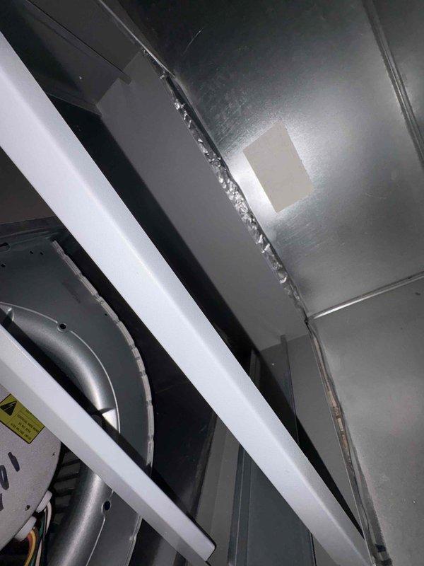 Completed inspector correction for identified ductwork issues. Accessed HVAC system interior compartments, inspected fan/blower motor assembly and associated wiring connections. Verified proper installation of metal structural components and ductwork channels to meet code requirements.