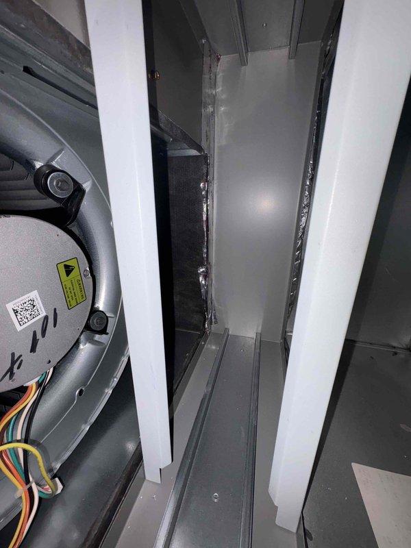 Completed inspector correction for identified ductwork issues. Accessed HVAC system interior compartments, inspected fan/blower motor assembly and associated wiring connections. Verified proper installation of metal structural components and ductwork channels to meet code requirements.