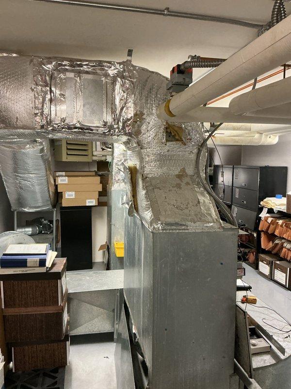 Performed comprehensive evaluation of existing Carrier air handler system for potential replacement. Inspected current installation in mechanical room, including ductwork configuration, PVC condensate lines, and available space constraints. Documented condition of reflective foil insulation and connections to determine appropriate specifications for new air handler quotation.