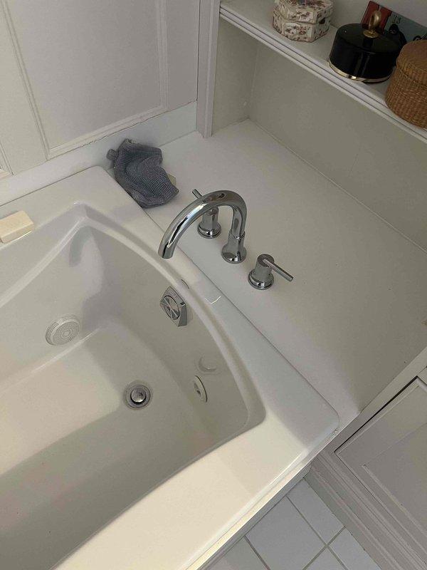Completed quoted repair to replace tub filler/faucet assembly. Opened wall to access plumbing, removed old hardware, and installed new tub filler system with three control knobs. Successfully restored proper function to bathtub plumbing system.