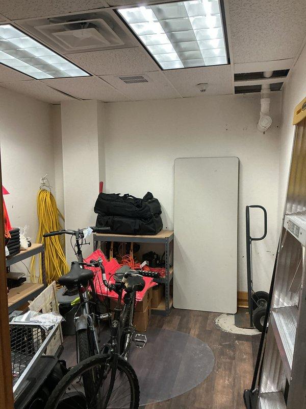 Responded to water leak service request for courtroom bathroom with frozen and broken drain lines. Conducted comprehensive inspection, documenting conditions in utility storage area and exterior foundation where PVC drain line was visible. Identified freeze damage at exterior wall penetration requiring repair of affected drain piping sections.