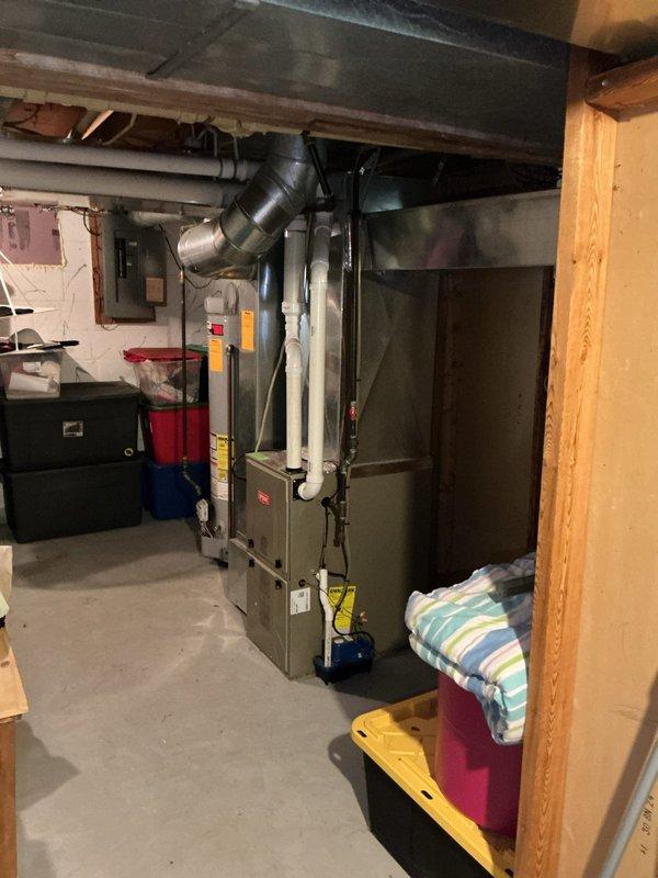 Conducted AC estimate for customer by evaluating existing HVAC system, which includes a Honeywell Home ProSeries thermostat and basement-located furnace unit with associated ductwork. Took comprehensive photos of the thermostat and furnace installation to document current setup for proper system sizing and replacement recommendations.