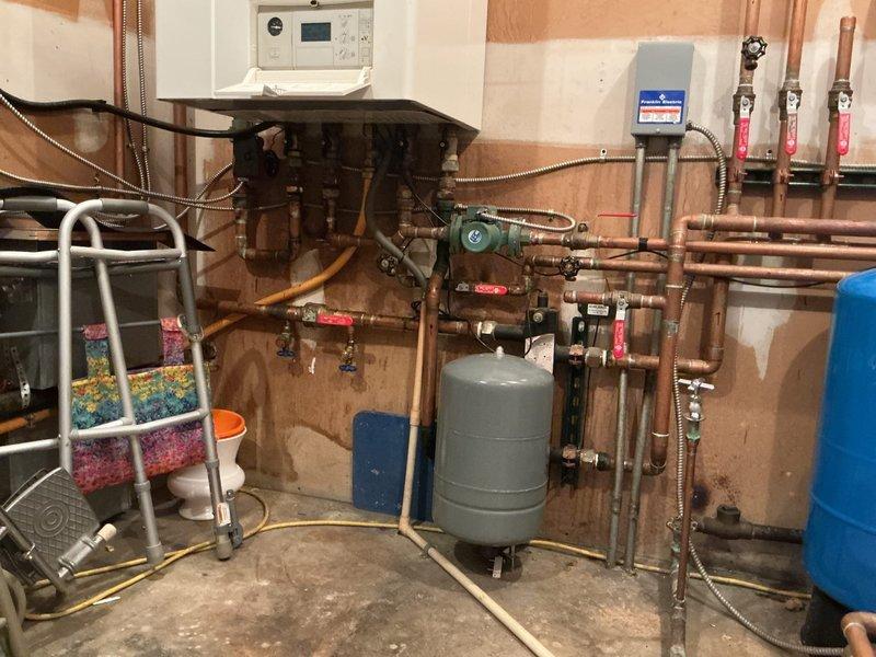 Completed a boiler estimate at customer's residence, examining a Vitodens 200 system that's unable to maintain pressure. Evaluated the current hydronic setup with multiple zones and discussed options including potential conversion to a forced air furnace system. Customer was presented with replacement and conversion alternatives based on assessment of the aging boiler and existing distribution infrastructure.