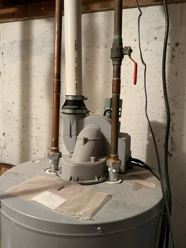 Completed estimate for replacement options of an aging water heater installed in basement utility area. Additionally assessed property for multi-head mini split system installation, documenting existing mechanical infrastructure including Honeywell control boxes and Amtrol expansion tank connected to copper plumbing network.