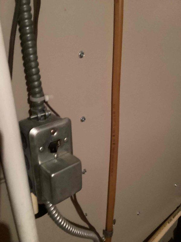 Responded to no heat call for 26-year-old Amana furnace. Inspected electrical junction box connections and verified power supply. Examined gas valve assembly with blue shutoff handle and checked copper supply line. Determined furnace was operating but not producing heat; restored proper heating function and confirmed system operation before departure.