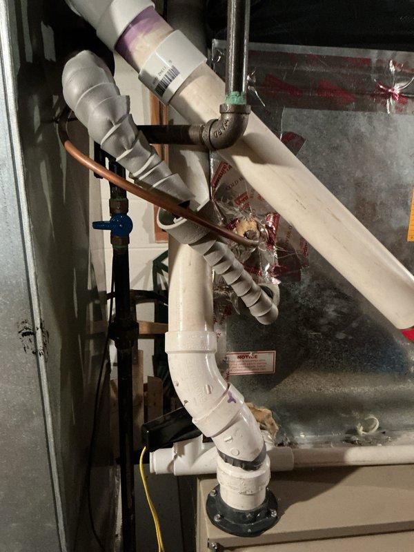 Performed furnace replacement estimate for customer who is currently using 4 space heaters as temporary heating solution. Documented existing HVAC system components including an Aprilaire air quality system and the current plumbing configuration with PVC and copper piping that would need to be integrated with any new installation.