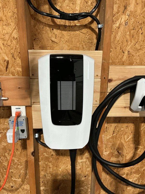 Conducted an on-site estimate for a standby generator installation. Inspected existing electrical infrastructure including the main circuit breaker panel and current electrical installations. Documented an EV charging station installation on OSB wall with associated wiring and weatherproof outlet for reference in determining appropriate generator capacity and connection requirements.