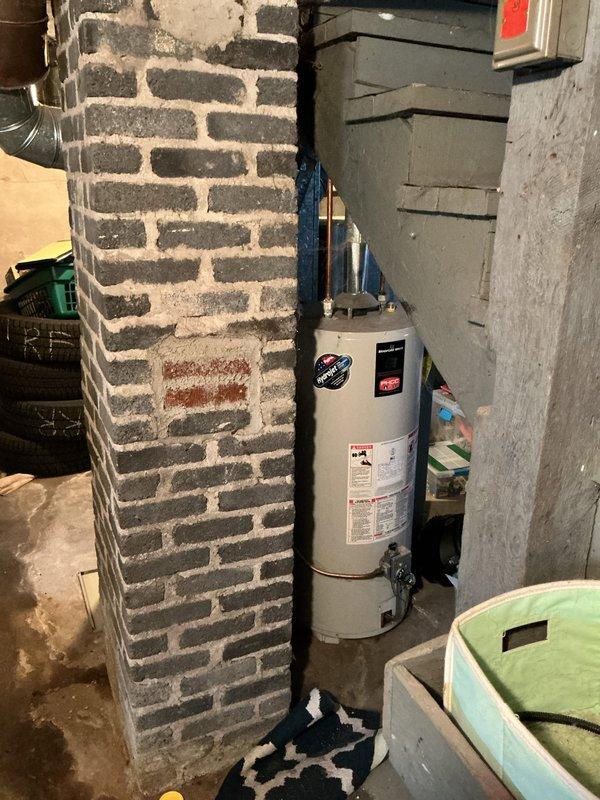 Conducted comprehensive sales estimate for furnace replacement and potential air conditioning system installation at residential property. Performed thorough assessment of existing basement HVAC equipment, including aging furnace unit with gray metal ductwork system extending from top of unit through exposed ceiling joists. Evaluated current mechanical room configuration, noting exposed brick walls, concrete flooring, and existing utility infrastructure including water heater and associated plumbing connections. Documented equipment conditions through detailed photography to support replacement recommendations. Provided customer with professional options for new furnace installation and discussed potential AC system integration with existing ductwork layout.