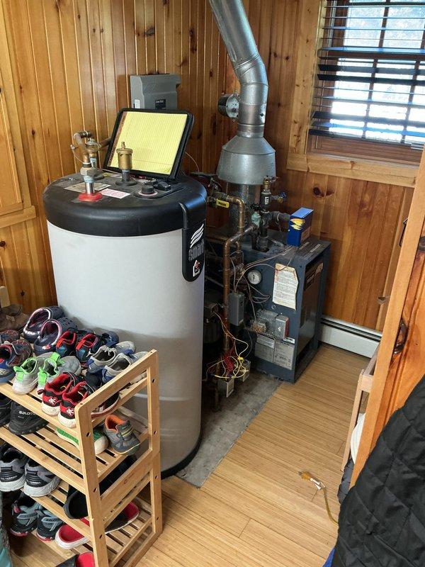 Conducted on-site assessment for boiler replacement estimate at owner-occupied residence. Evaluated existing 27-year-old boiler system currently in operational condition, documented electrical panel configuration and existing mechanical equipment setup including water heater and heating unit with associated piping and ductwork, and provided replacement options and recommendations to customer.