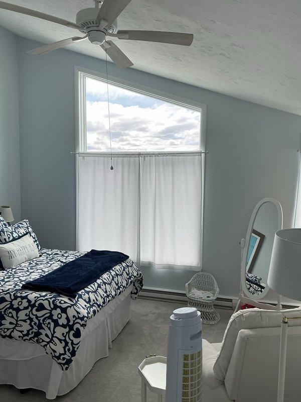 Conducted comprehensive site assessment for new air conditioning system installation in a 2,000 square foot, three-bedroom condominium unit with no existing HVAC equipment. Evaluated interior spaces including bedroom areas with vaulted ceilings and exterior building structure to determine optimal equipment placement, ductwork routing, and condenser unit location. Documented property conditions and measured spaces to develop appropriate system sizing recommendations and installation specifications for spring implementation timeline.