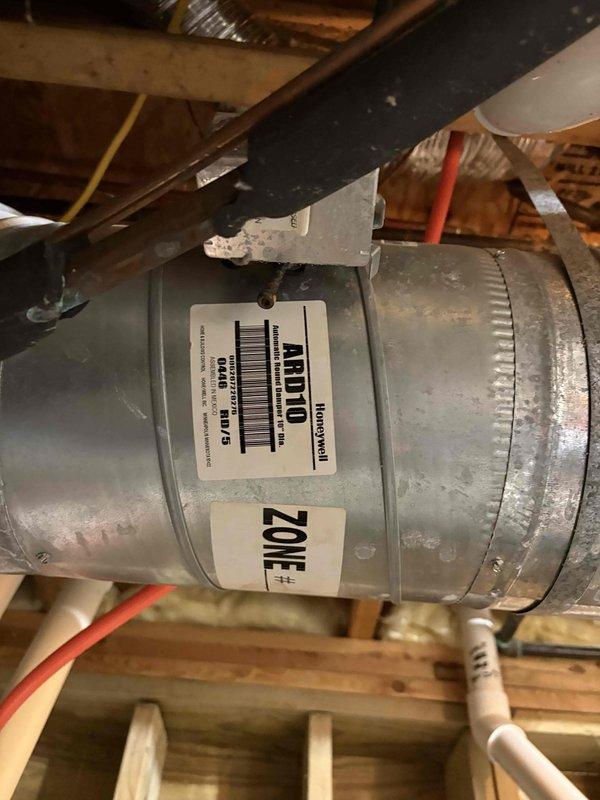 Responded to complaint of uneven heating between zones, with one zone reaching 88°F while another only achieved 52°F. Inspected Honeywell ZD8X14 automatic switchover 8-zone control panel and associated zone dampers. Documented equipment including zone controller and ART10 Honeywell zone damper for Zone #1. Purged air from affected zone's heating loop to restore proper circulation and heat distribution. Verified zone controller operation and damper functionality. Photographed equipment for client records and noted equipment information previously missing from account. System restored to proper multi-zone operation with balanced heat distribution across all zones.