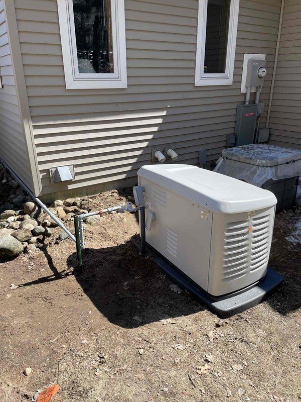 Completed installation of Generac standby generator system at residential property. Generator unit mounted on composite pad adjacent to existing HVAC equipment with proper clearances maintained from structure. Coordinated utility disconnect/reconnect service for safe electrical integration. Obtained electrical permit and completed all required inspections. Installed transfer switch and established connections between generator, main electrical panel, and utility service. Verified proper grounding, conduit routing, and weatherproof connections per manufacturer specifications and local electrical code requirements. System tested and operational upon completion.