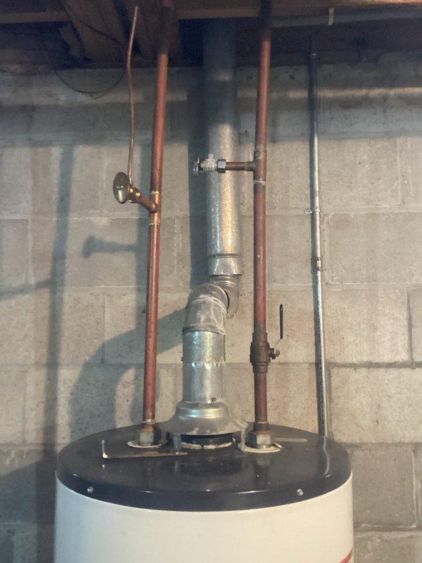 Completed annual heating maintenance and preventive tune-up on Amana furnace system in basement utility area. Performed comprehensive inspection of furnace unit, ductwork connections, and associated HVAC components. Verified proper operation of heating system, checked all electrical connections, inspected heat exchanger, tested safety controls, and cleaned burner assembly. Documented equipment age and updated service records with unit information. All mechanical systems including furnace, water heater, and humidifier found to be operating within normal parameters with no immediate repairs required at time of service.