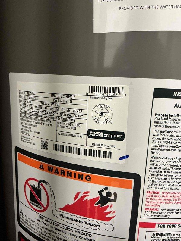 Completed water heater estimate for residential unit manufactured in September 2017. Assessed existing gas water heater condition, documented unit specifications and safety labels, and photographed installation including venting components for replacement recommendations.