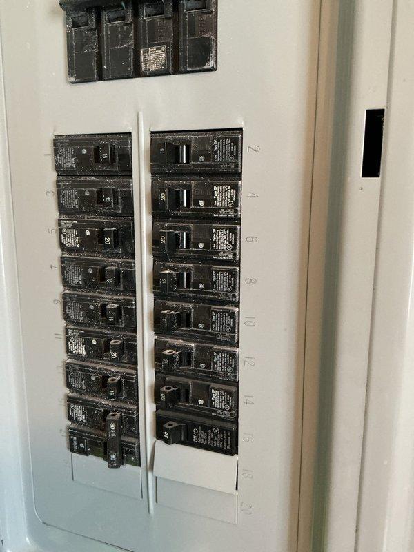 Conducted on-site assessment for standby generator installation. Evaluated existing electrical service panel configuration and identified suitable exterior mounting location on building with vinyl siding near concrete foundation. Documented current electrical infrastructure including main breaker panel with dual-column circuit breaker arrangement. Photographed proposed installation area and existing electrical components to develop accurate estimate for Kohler standby generator system. Customer expressed interest in whole-home backup power solution.