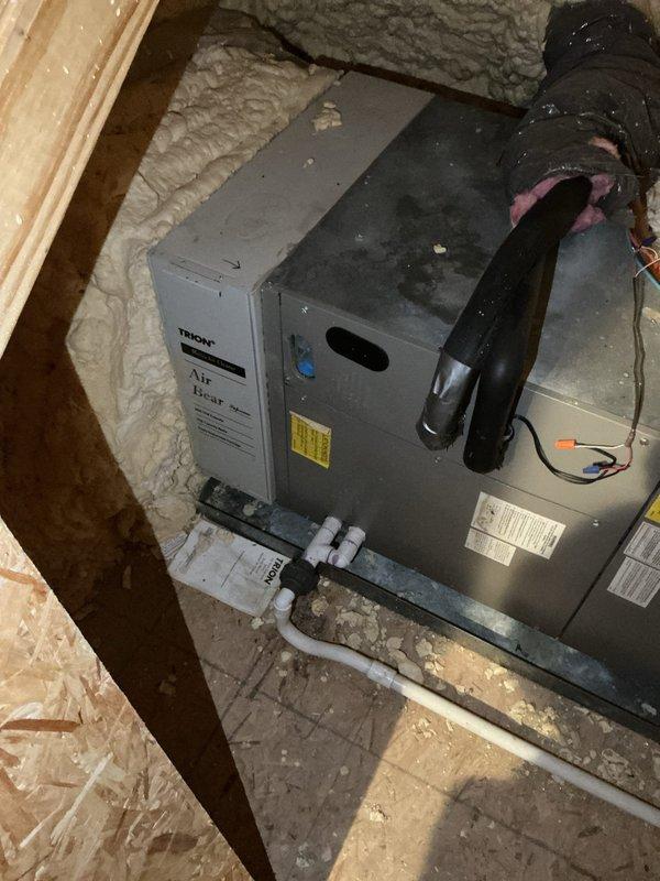 Conducted comprehensive estimate for air conditioning system replacement. Evaluated existing air handler unit located in attic space with spray foam insulation environment. Documented current equipment condition including air handler placement, refrigerant line connections, electrical wiring configurations, condensate drainage system with white PVC piping, and black flexible ductwork connections. Assessed installation space constraints, clearances around unit, concrete pad foundation, and accessibility for future equipment replacement. Photographed manufacturer labels, specification tags, and overall system layout to provide accurate equipment sizing and installation requirements for proposed AC system upgrade.