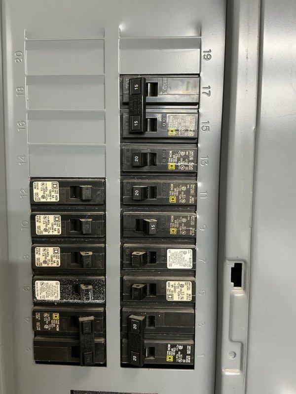 Conducted site evaluation for standby generator installation. Assessed existing electrical infrastructure including main service panel and utility meter to determine system compatibility and capacity requirements. Documented current electrical configuration showing 240V 2-wire service with Great Lakes Energy metering, main distribution panel with mixed circuit breaker population, and available panel capacity. Evaluated electrical load requirements, service entrance specifications, and optimal generator placement options to develop comprehensive installation estimate.