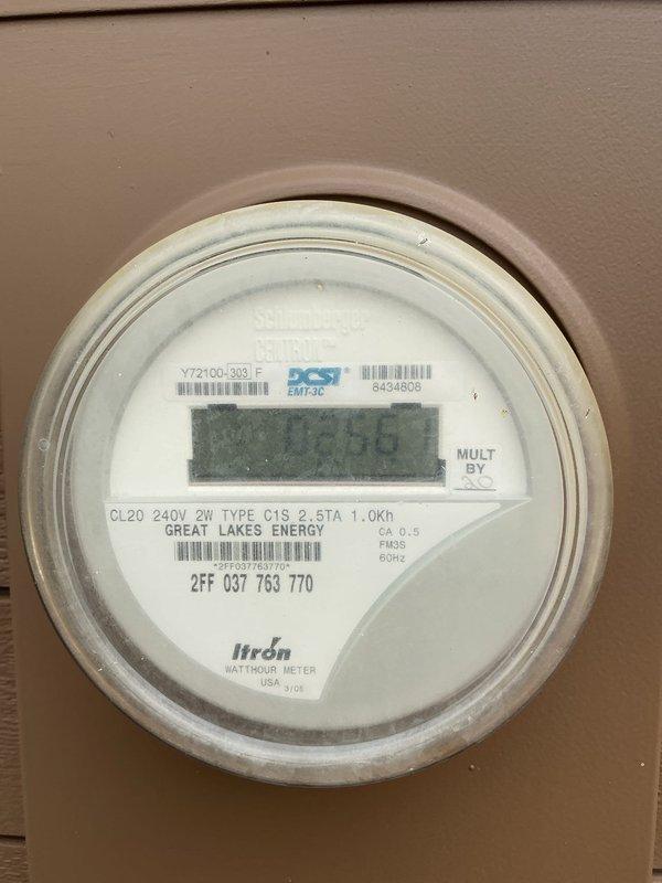 Conducted site evaluation for standby generator installation. Assessed existing electrical infrastructure including main service panel and utility meter to determine system compatibility and capacity requirements. Documented current electrical configuration showing 240V 2-wire service with Great Lakes Energy metering, main distribution panel with mixed circuit breaker population, and available panel capacity. Evaluated electrical load requirements, service entrance specifications, and optimal generator placement options to develop comprehensive installation estimate.
