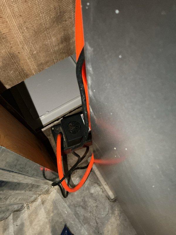 Conducted on-site assessment of existing residential HVAC system in basement mechanical room to provide furnace replacement estimate. Evaluated current gray metal furnace unit, documented equipment specifications, clearances, and existing ductwork configuration, and photographed installation area including adjacent water heater and utility connections to determine replacement requirements and system compatibility.