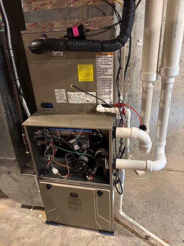 Completed full HVAC system replacement including removal and disposal of existing furnace and air conditioning equipment. Installed new Bryant outdoor condensing unit on existing concrete pad in backyard area and new two-stage furnace with variable speed ECM blower motor in basement utility space. Ran new PVC condensate drainage system with proper pitch and termination. Completed all electrical connections to furnace control board and installed new thermostat wiring. Verified proper airflow, refrigerant charge, and system operation. All equipment tested and operational upon departure.