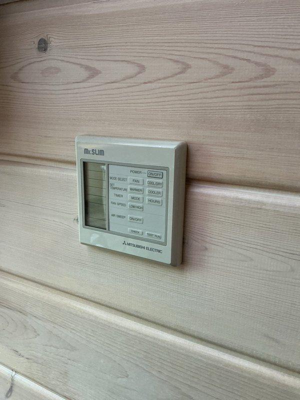 Conducted on-site estimate for mini-split system installation. Inspected existing Mitsubishi Electric Mr. Slim system including wall-mounted control panel and indoor air handler unit. Documented current equipment condition and location, photographed control interface and indoor unit mounted beneath wooden beam structure. Prepared quote for requested mini-split installation based on site assessment and customer requirements.
