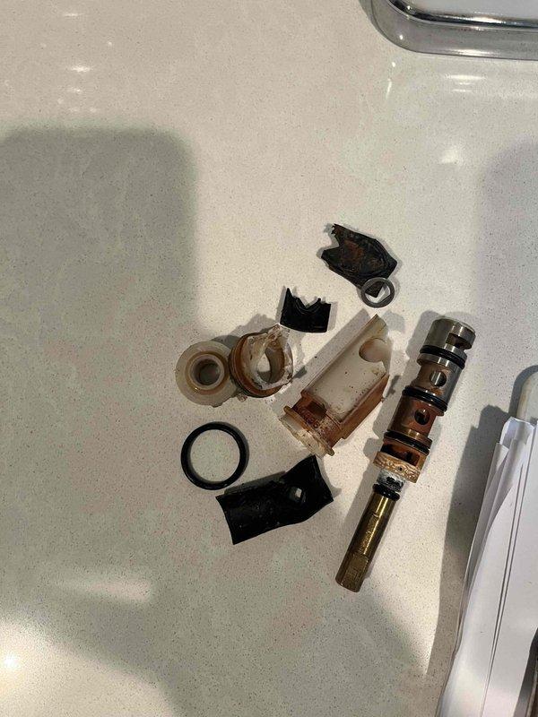 Completed annual cottage turn-on service including full system activation and plumbing inspection. Disassembled, cleaned, and rebuilt Moen faucet cartridge assembly due to mineral buildup and deterioration of internal components, replacing worn O-rings, gaskets, and seals to restore proper function. Coordinated arrival time as requested and consulted with property owner regarding optimal thermostat settings for the season.