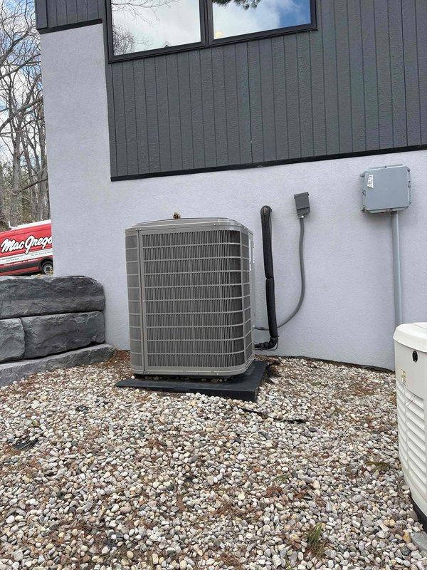 Responded to service call to evaluate residential HVAC system for potential serviceability. Upon arrival, conducted thorough assessment of outdoor air conditioning condenser unit and associated indoor mechanical systems. The outdoor unit, a residential AC condenser with beige metal casing, was found properly mounted on base pad with gravel foundation and appropriate electrical disconnect boxes installed per code requirements.

Interior inspection revealed a complex water treatment and hydronic heating system including whole-house water filtration with blue cylindrical filter housing, white expansion tank, and electric circulator pump integrated into copper piping network. All components appeared to be functioning within normal parameters with proper mounting and connections. Electrical monitoring equipment and control panel were observed in good working condition.

Documented system configuration with photographs for reference and determined that while the installation is more complex 
