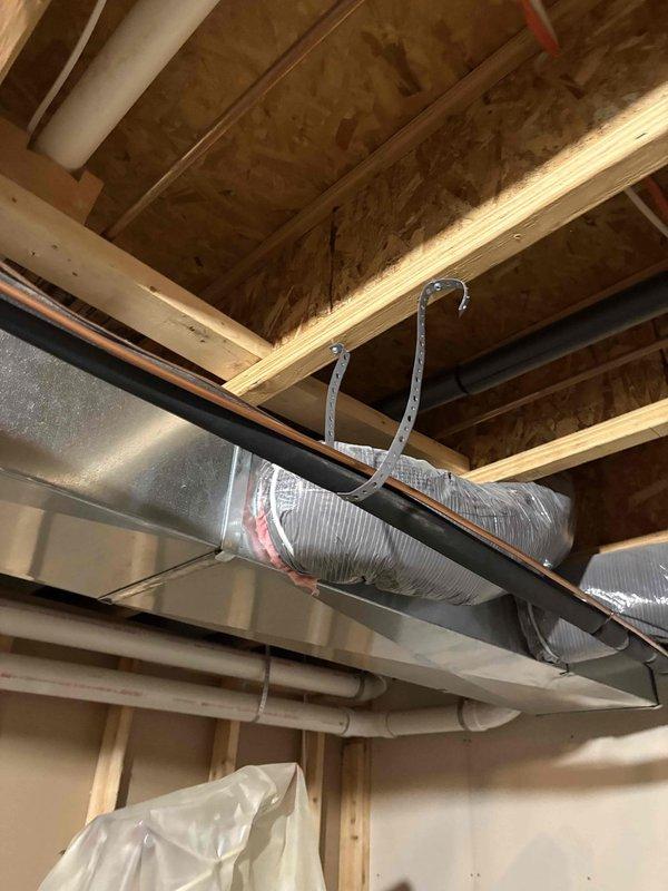 Completed annual heating maintenance and tune-up on furnace system, including full inspection per service plan protocol. Documented serial number CVAV3617XMA as requested and photographed equipment installation. Addressed inspector correction by securing water heater exhaust vent with proper fasteners where screws or rivets were previously missing, ensuring proper attachment and code compliance.