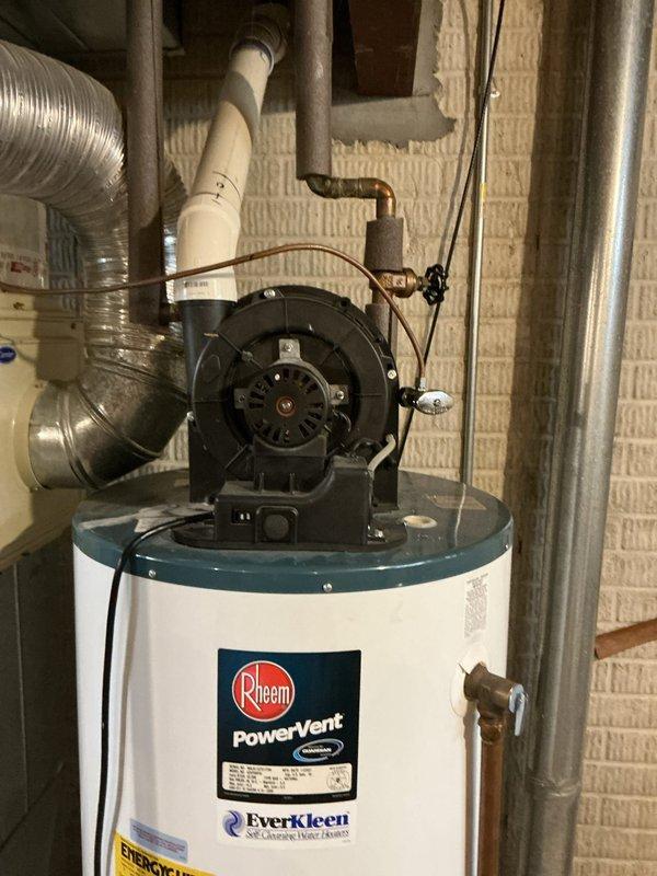 Completed estimate for replacement of 19-year-old Rheem PowerVent water heater with Everkleen self-cleaning system located in basement mechanical room. Documented existing unit configuration including power vent blower assembly, PVC venting, copper supply lines, and brass fittings to provide accurate replacement specifications and pricing options.