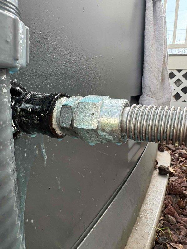 Performed annual heating system inspection on Bryant furnace. During inspection, discovered a gas leak at the generator coupling located downstream of the gas shutoff valve. The coupling showed signs of corrosion and oxidation, with visible weathering on the connection components. Immediately shut off gas supply to the generator to eliminate the safety hazard. Documented the leak location with photographs showing the corroded coupling between the black flexible gas line and metallic corrugated line. Unit failed inspection due to this gas leak violation and requires coupling replacement before system can be safely returned to service.