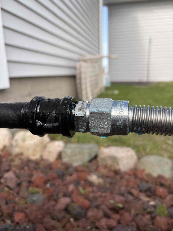 Performed annual heating system inspection on Bryant furnace. During inspection, discovered a gas leak at the generator coupling located downstream of the gas shutoff valve. The coupling showed signs of corrosion and oxidation, with visible weathering on the connection components. Immediately shut off gas supply to the generator to eliminate the safety hazard. Documented the leak location with photographs showing the corroded coupling between the black flexible gas line and metallic corrugated line. Unit failed inspection due to this gas leak violation and requires coupling replacement before system can be safely returned to service.