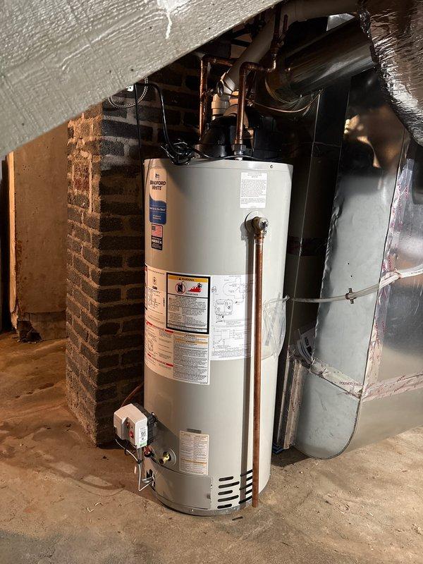 Completed comprehensive HVAC system upgrade and electrical service enhancement. Removed and disposed of existing furnace and water heater. Installed new Bryant high-efficiency furnace with metallic ductwork system, including flexible and rigid duct sections secured with metal straps and clamps. Installed 14.3 SEER2 condensing unit with exterior pad for air conditioning system.

Removed old water heater and installed 40-gallon natural gas power vented water heater in basement utility area against brick wall. Reconnected natural gas line with new gas shutoff valve for safety compliance. Ran new PVC venting to exterior wall and properly terminated per code requirements. Reconnected copper hot and cold water lines with new 1/4 turn shutoff valves for improved serviceability. Completed electrical connections including breaker, circuit, and whip installation for water heater operation.

Performed electrical service upgrade by removing existing 100A panel and installing new 200A panel in base
