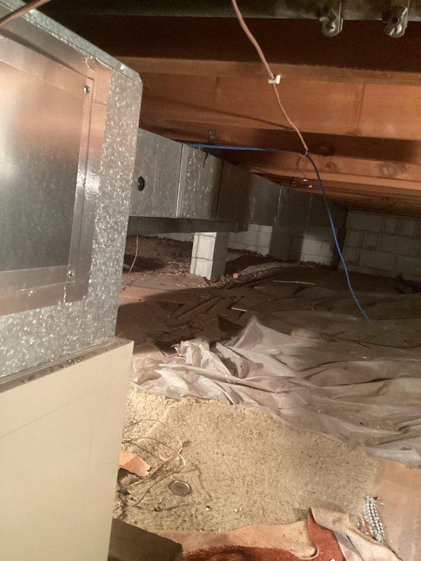 Responded to gas leak concern with reported high CO2 readings in residential property with 20+ year old equipment. Performed comprehensive safety inspection of basement mechanical room housing water heater and furnace unit, as well as crawl space area with exposed HVAC ductwork. Conducted combustion analysis and gas leak detection throughout all equipment and connection points, verified proper ventilation, and documented equipment condition with photos for service records.