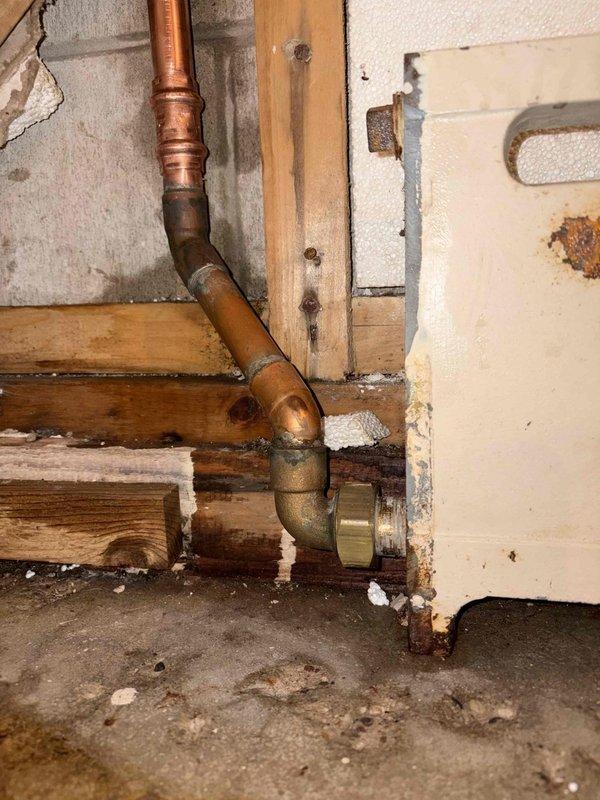 Responded to service call for depressurized Bosch aluminum boiler system. Upon arrival, discovered system had lost pressure due to a nail hole in copper piping that the homeowner had attempted to repair. Inspected the affected copper piping sections in the basement utility area, identifying the compromised connection points and assessing the extent of the damage. Performed necessary repairs to the damaged copper pipe section, ensuring proper sealing and structural integrity of the plumbing connections. Refilled system with appropriate antifreeze solution to manufacturer specifications. Pressurized the boiler system to proper operating levels and conducted thorough leak testing to verify repair integrity. System restored to full operational status with proper pressure maintained throughout testing period.