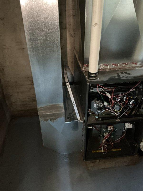 Conducted on-site evaluation for air conditioning system and bathroom fan installation estimate. Inspected existing HVAC equipment including furnace unit, air handler, and ductwork configuration. Documented significant condensation accumulation on metal ductwork indicating potential inadequate insulation or humidity control issues. Noted current filter size specifications at 16x24x1 and assessed overall system condition including aging components with visible wear patterns. Evaluated mechanical space accessibility and existing infrastructure to determine scope of work for AC installation and bathroom ventilation fan addition. Captured photographic documentation of equipment layout, ductwork routing, and moisture concerns to support estimate preparation.