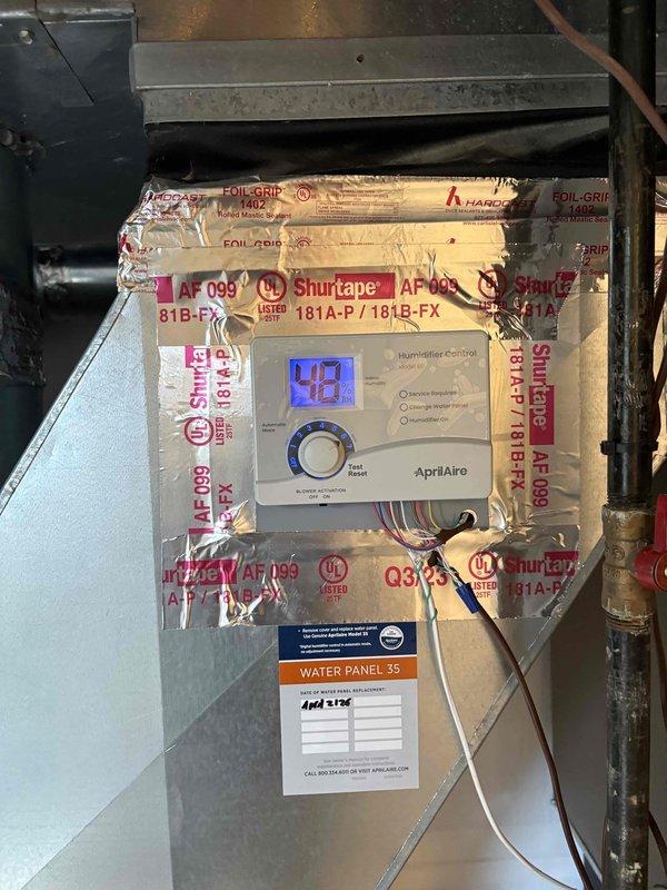Installed AprilAire humidistat control unit on existing HVAC system as quoted. Mounted digital control panel with outdoor temperature compensation settings on wooden backing board adjacent to ductwork, completed all electrical connections, and verified proper operation with system.