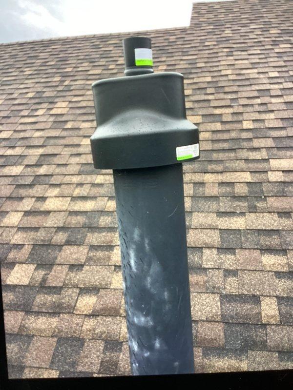 Returned to address venting issue by installing Centrotherm flexible B-vent kit and connecting existing PVC venting to the new venting system. Chimney parts that were previously received and staged were utilized to complete the installation. Venting components were properly secured and marked for identification, ensuring proper exhaust ventilation through the roof penetration.