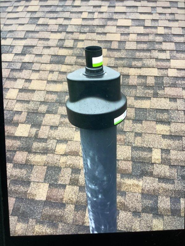 Returned to address venting issue by installing Centrotherm flexible B-vent kit and connecting existing PVC venting to the new venting system. Chimney parts that were previously received and staged were utilized to complete the installation. Venting components were properly secured and marked for identification, ensuring proper exhaust ventilation through the roof penetration.