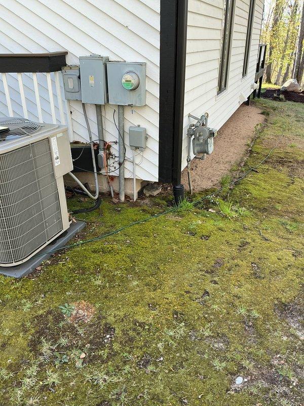 Conducted site assessment for standby generator installation and gas line extension for outdoor grill hookup. Evaluated existing electrical service panel location, available space adjacent to AC condenser unit, and optimal generator placement on side of residence. Documented current electrical infrastructure including meter configuration and determined routing requirements for new gas line to reach deck area where grill will be installed.