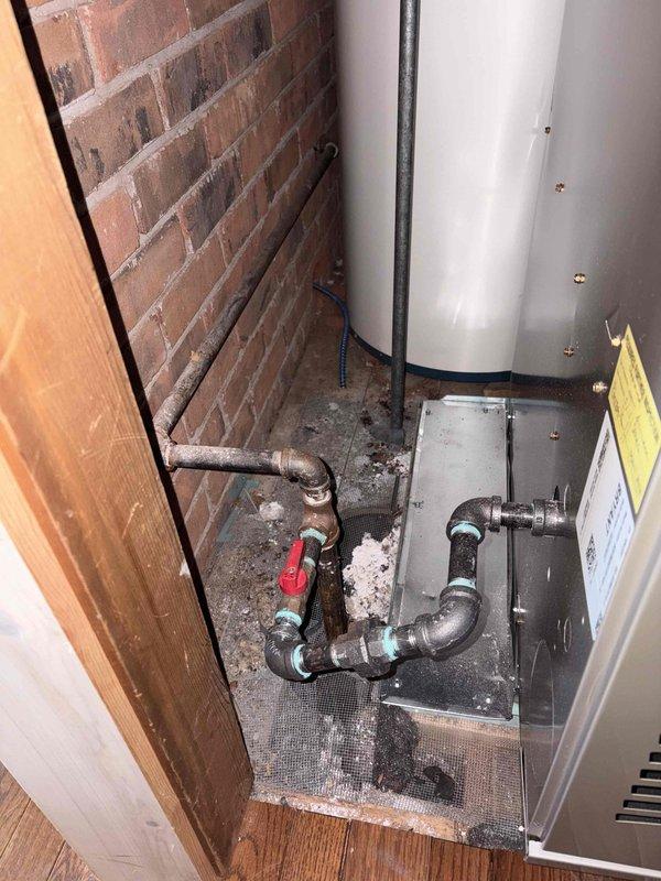 Installed code-compliant sediment trap on gas line serving water heater per 2015 MRC G2419.4 requirements and manufacturer specifications. Correction addressed inspection disapproval PM2025-1053, ensuring proper sediment filtration protection for gas appliance. Documentation photos captured showing completed installation with proper fittings and valve configuration.