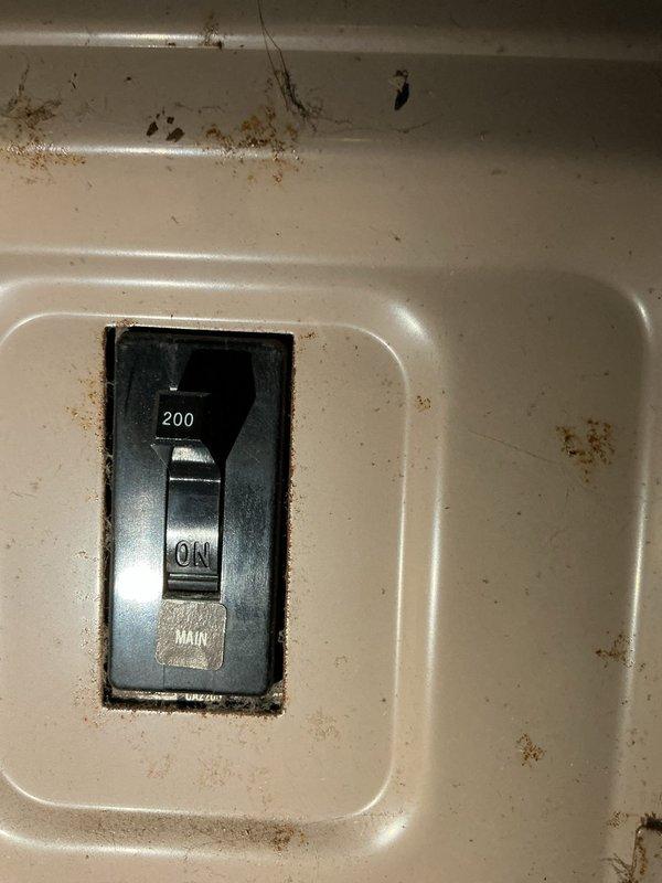 Conducted on-site evaluation for mini-split air conditioning system installation in residential home office space. Assessed electrical infrastructure including existing 200-amp main breaker panel, which showed significant rust deterioration and moisture exposure requiring consideration for system compatibility and potential electrical upgrades. Documented installation location and provided estimate for ductless mini-split AC solution.
