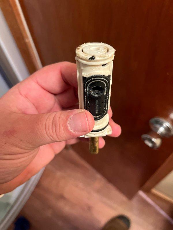 Responded to no-water issue in shower following seasonal water turn-on. Diagnosed faulty shower valve cartridge with significant mineral buildup and deteriorated internal seals preventing water flow. Removed and replaced worn cartridge, restoring full water pressure and functionality to the shower fixture.