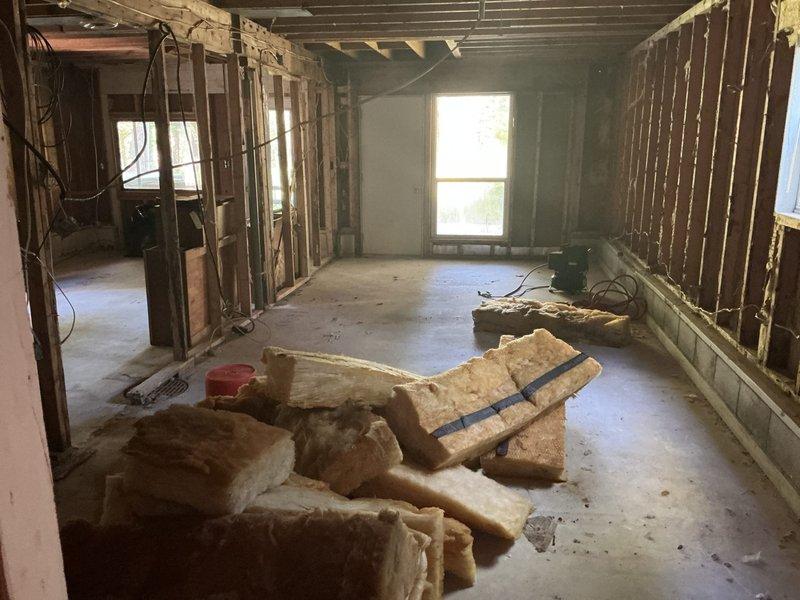 Conducted on-site assessment for complete HVAC system installation at cottage property with no existing heating or cooling equipment. Evaluated interior space currently under renovation with exposed framing, structural elements, and wood stove as sole heat source. Documented site conditions including available space for equipment placement, electrical and ductwork routing requirements, and structural considerations for new system installation. Provided comprehensive estimate for furnace and air conditioning installation with all necessary components and infrastructure.