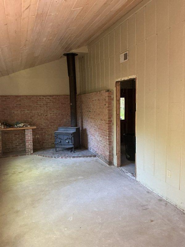 Conducted on-site assessment for complete HVAC system installation at cottage property with no existing heating or cooling equipment. Evaluated interior space currently under renovation with exposed framing, structural elements, and wood stove as sole heat source. Documented site conditions including available space for equipment placement, electrical and ductwork routing requirements, and structural considerations for new system installation. Provided comprehensive estimate for furnace and air conditioning installation with all necessary components and infrastructure.