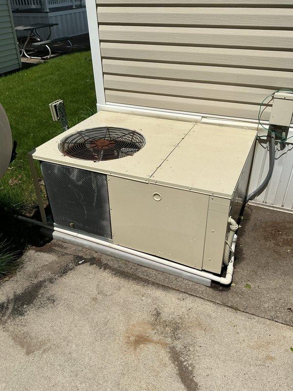 Performed site assessment for new heat pump installation at residential property with no existing HVAC equipment. Evaluated electrical panel capacity and confirmed adequate breaker availability for new system installation. Provided estimate for complete installation of Goodman GPHM3A two-ton multi-position heat pump system including all necessary electrical connections, refrigerant lines, and outdoor unit placement on existing concrete pad.