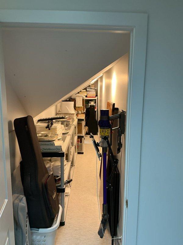 Conducted on-site assessment for installation of five mini-split AC systems in residential property. Evaluated bedroom space with existing wall-mounted unit and under-stair storage area to determine optimal placement, electrical requirements, and installation logistics for new ductless HVAC equipment. Documented existing conditions through photographs to support equipment sizing and installation estimate preparation.