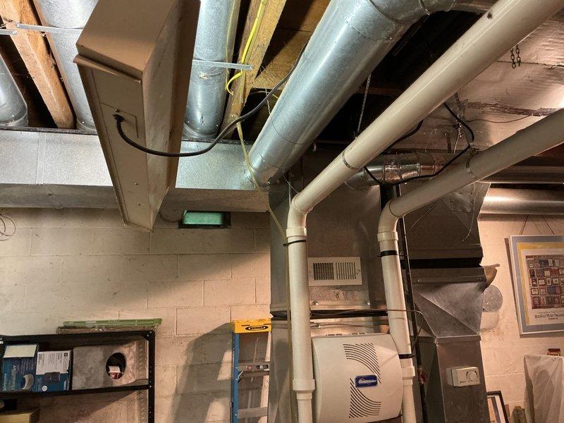 Conducted sales estimate for supplemental electric heating system to service specific rooms in home currently heated by existing Goodman furnace. Assessed basement mechanical room configuration, existing ductwork layout, and HVAC infrastructure including current furnace placement, PVC venting system, and metal ductwork distribution throughout ceiling joists. Evaluated electrical capacity and equipment placement options for integration of electric supplemental heating solution to complement existing forced-air heating system.